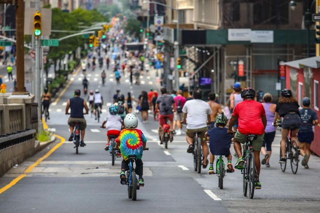 Dozens of bicyclists can be seen on Park Avenue during Summer Streets